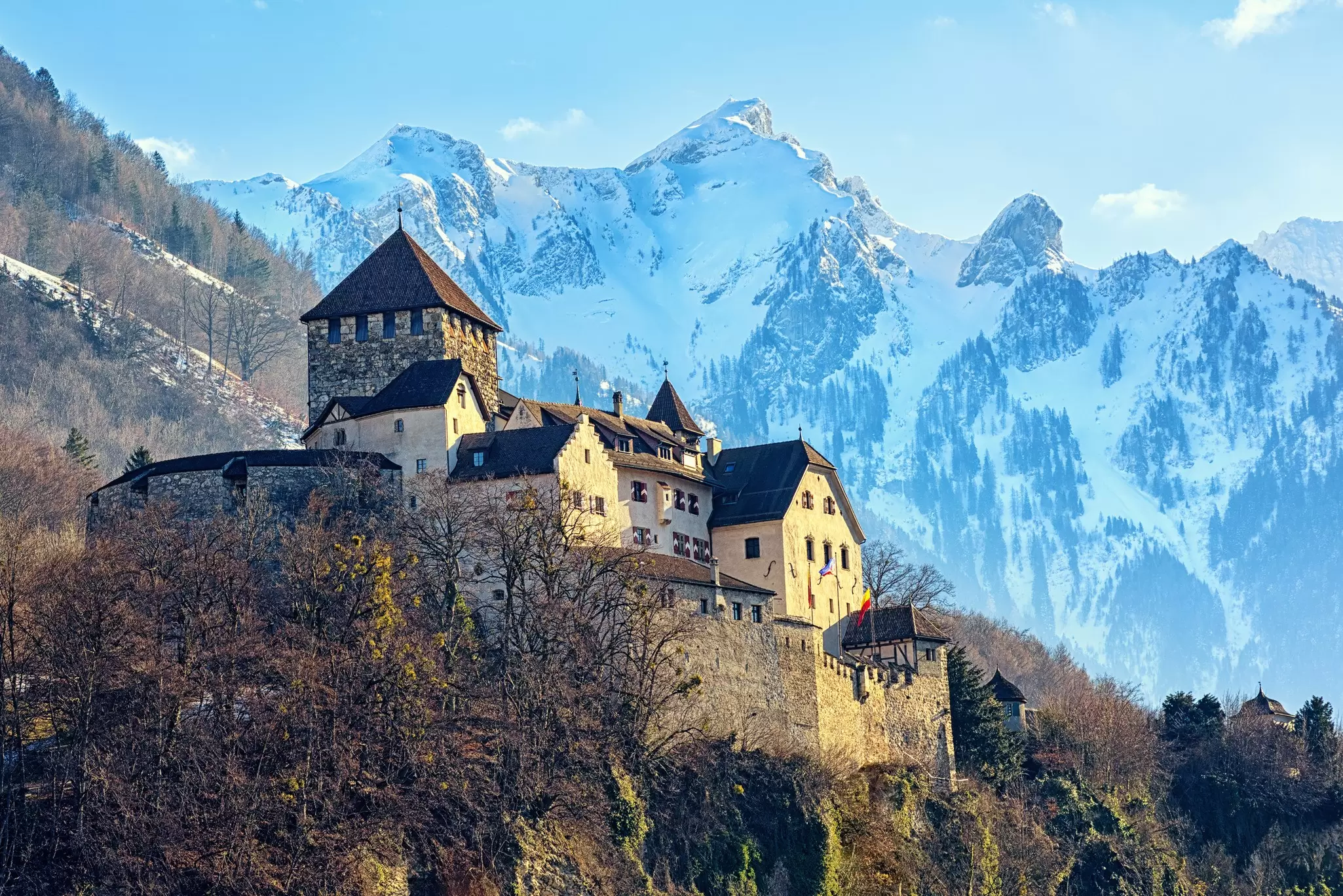 Vaduz Castle surrounded by snow-covered peaks. Boris Stroujko/Shutterstock