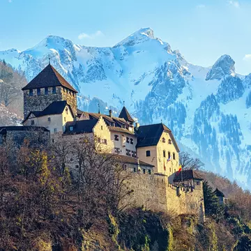 Vaduz Castle surrounded by snow-covered peaks. Boris Stroujko/Shutterstock