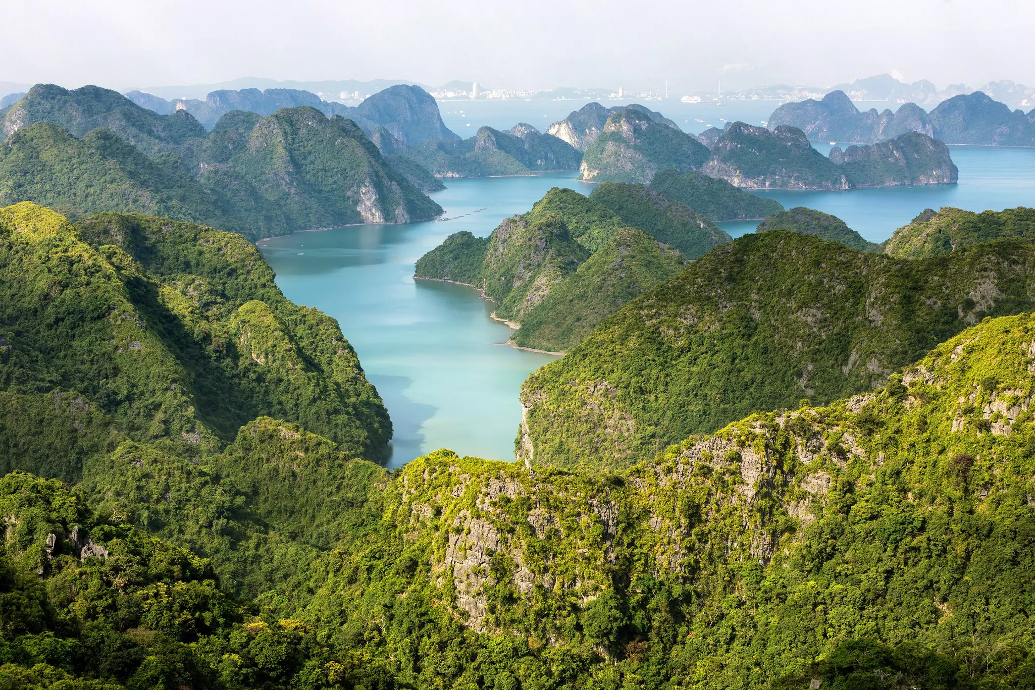 Hilly green islands in a blue bay in Vietnam.