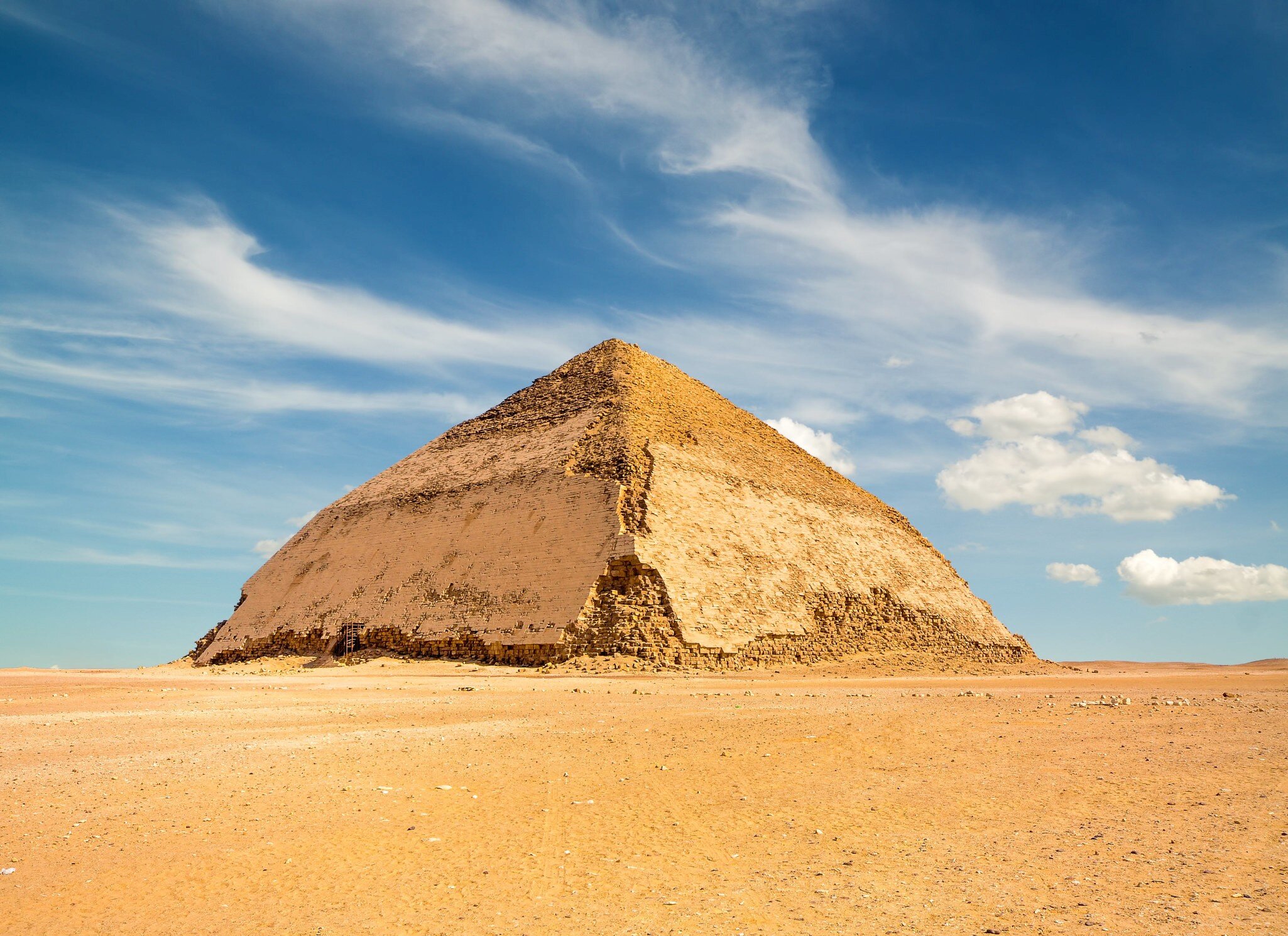 Bent Pyramid under wispy clouds outside Dahshur. 