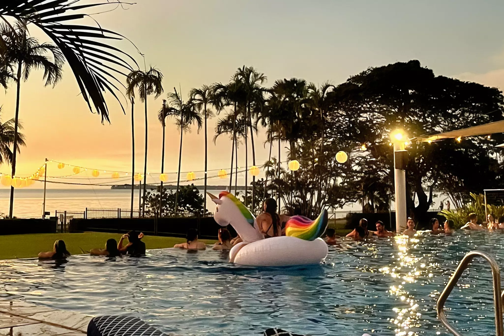 Watching the sun set from the pool with DJs playing on a Sunday evening at the Mindil Beach Casino Resort © Tasmin Waby / Lonely Planet