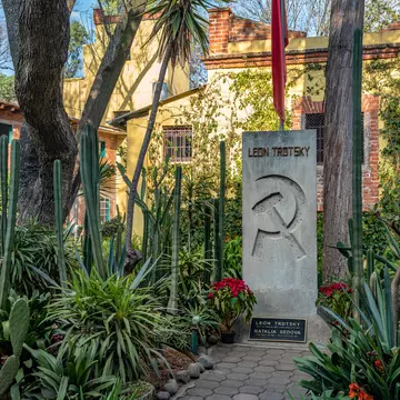 COYOACAN, MEXICO - OCT 28, 2016: Leon Trotsky grave with the Soviet symbolic in his House Museum, a place honoring Lev Davidovich Trotskiy and an organization that works to promote political asylum; Shutterstock ID 528968617;