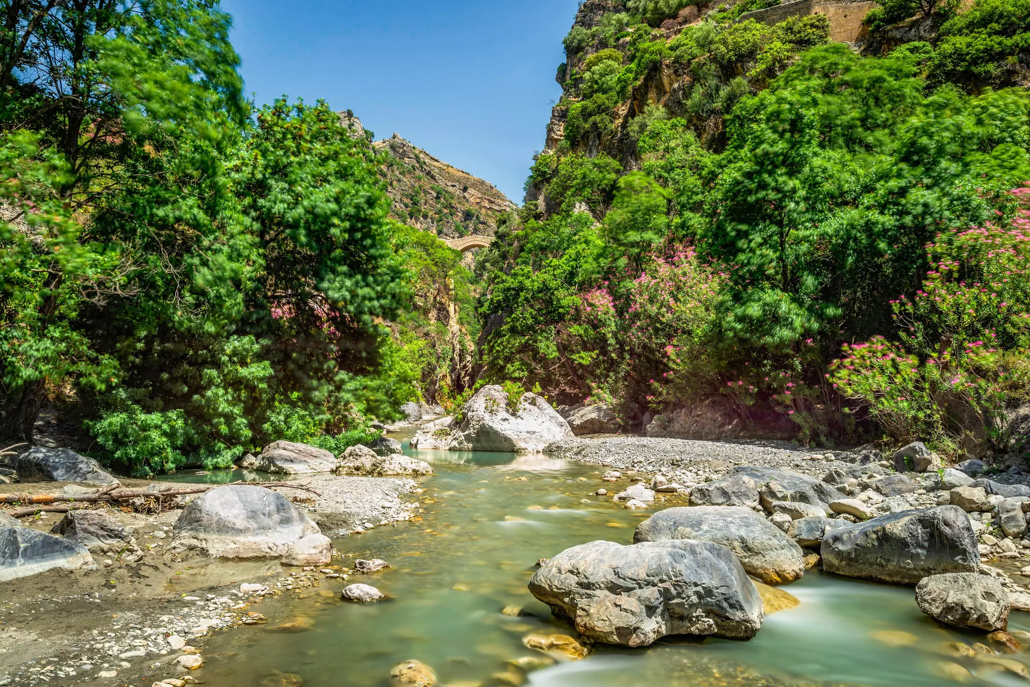 views of the Devil Bridge over the Raganello river in Civita village inside the Pollino National Park