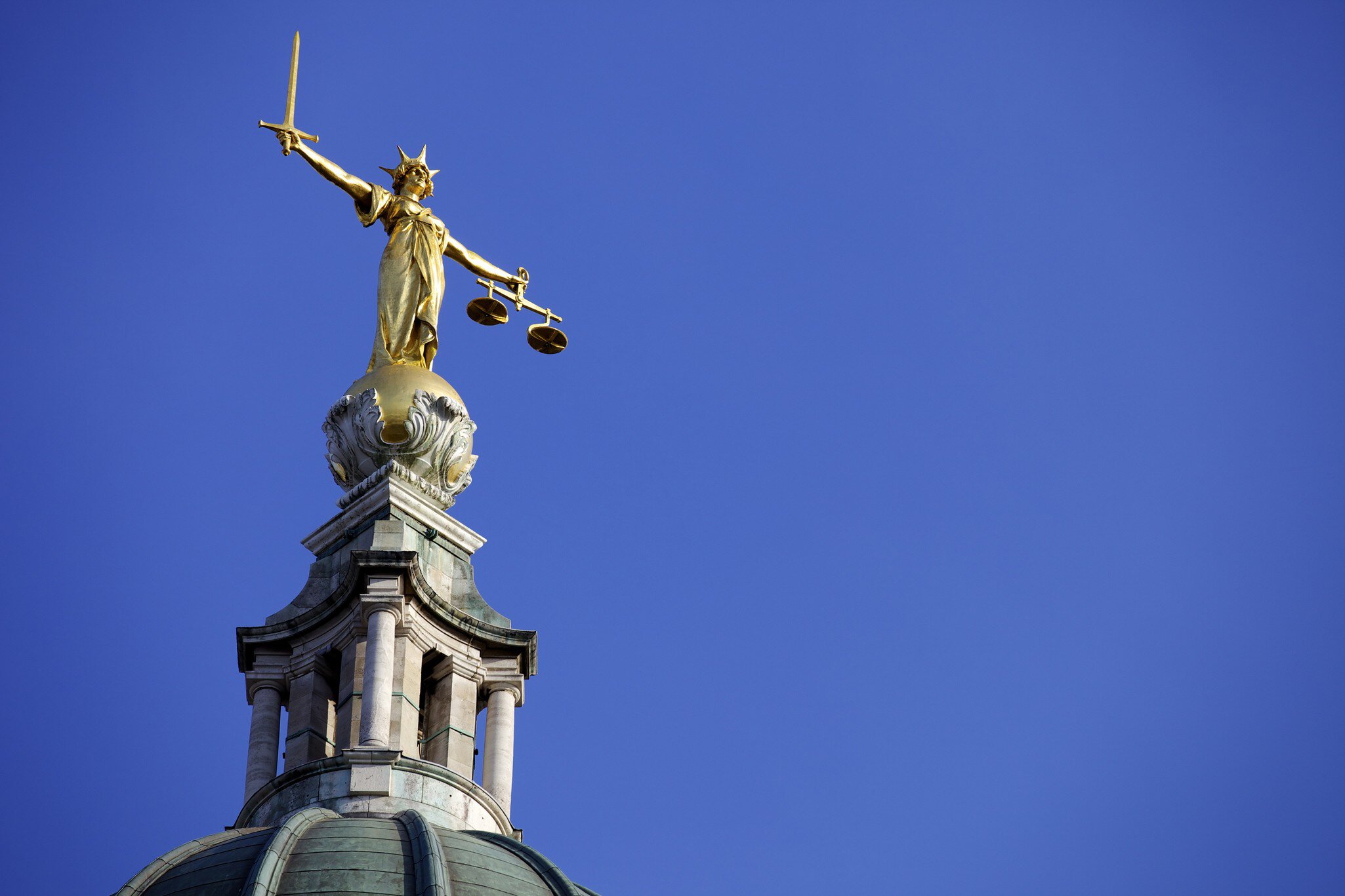 Scales of Justice above the Old Bailey Law Courts (Central Criminal Court) on former site of Newgate Prison, London, England, United Kingdom, Europe