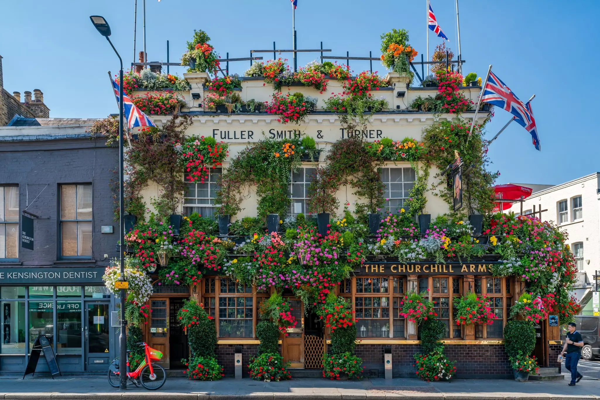 The most colourful pub in London located in Notting Hill, Churchill Arms Public House, is decorated with hanging baskets full of beautiful flowers during the summertime.