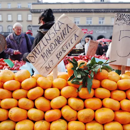 Local market scene with fresh oranges