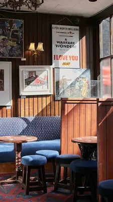 Sunlight casts a glow on the interior of a traditional pub