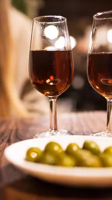 Vermouth and olive tapas for two at a rustic, classic wine bar in Spain