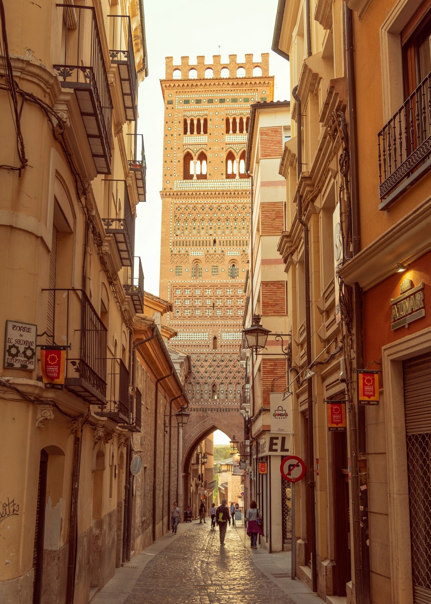 View of Torre de El Salvador from a narrow street in Teruel, Spain.