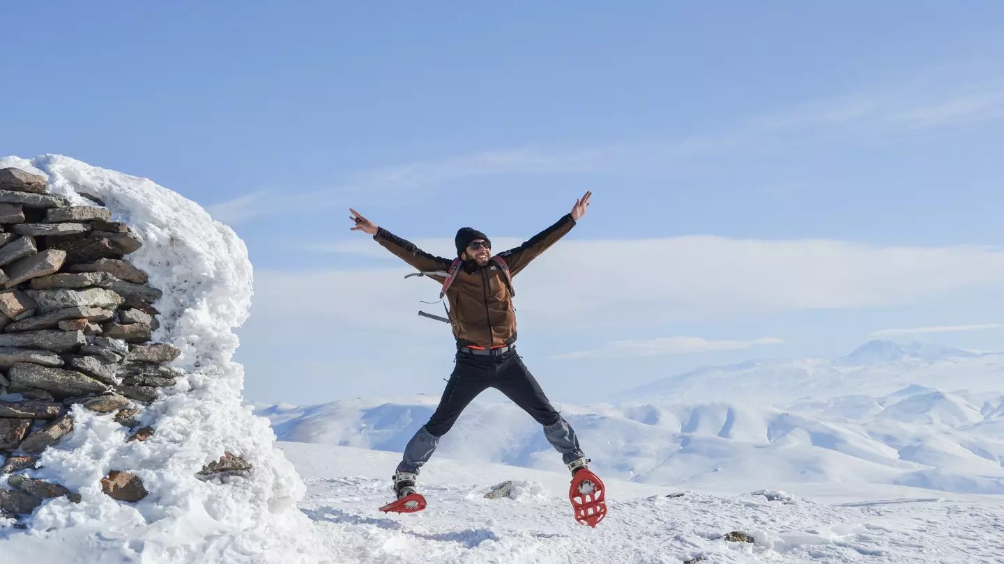 Elsewhere local expert Hakob Harutyunyan celebrates a winter hike in Armenia © Courtesy of Hakob Harutyunyan