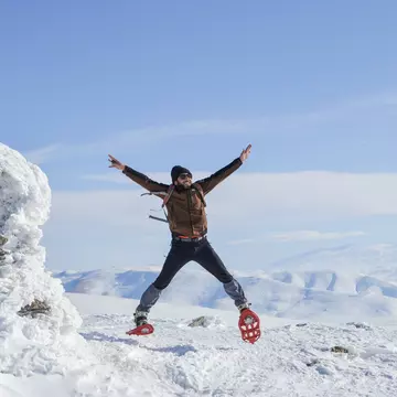 Elsewhere local expert Hakob Harutyunyan celebrates a winter hike in Armenia © Courtesy of Hakob Harutyunyan