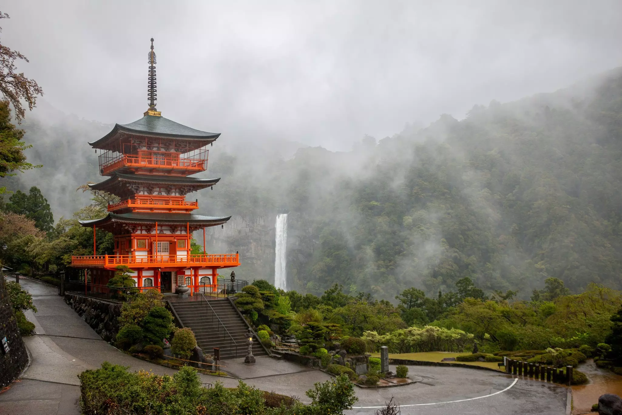 A pagoda in dense misty forest