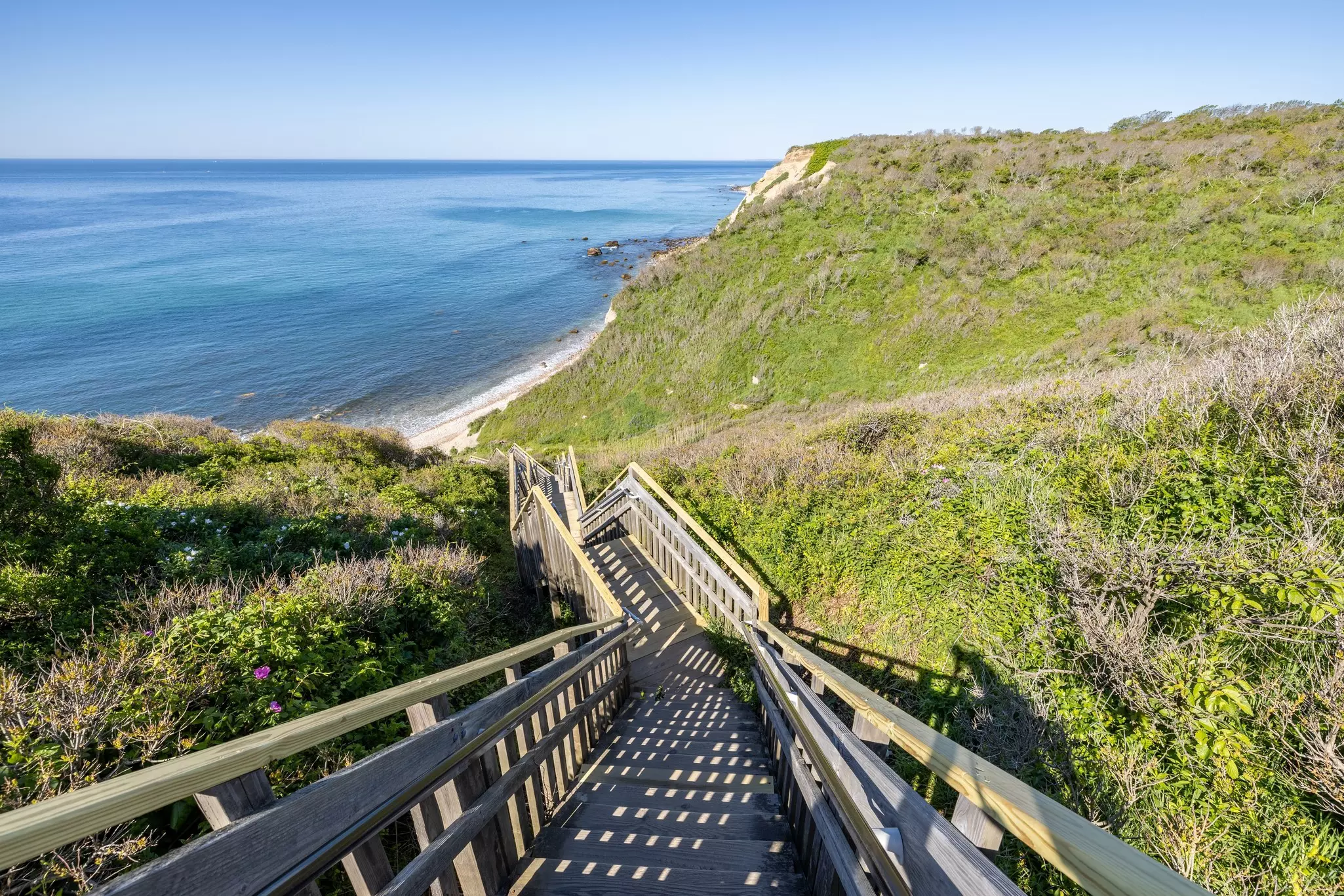 Long wooden staircase leading down to the beach at Mohegan Bluffs, Block Island, Rhode Island, USA,