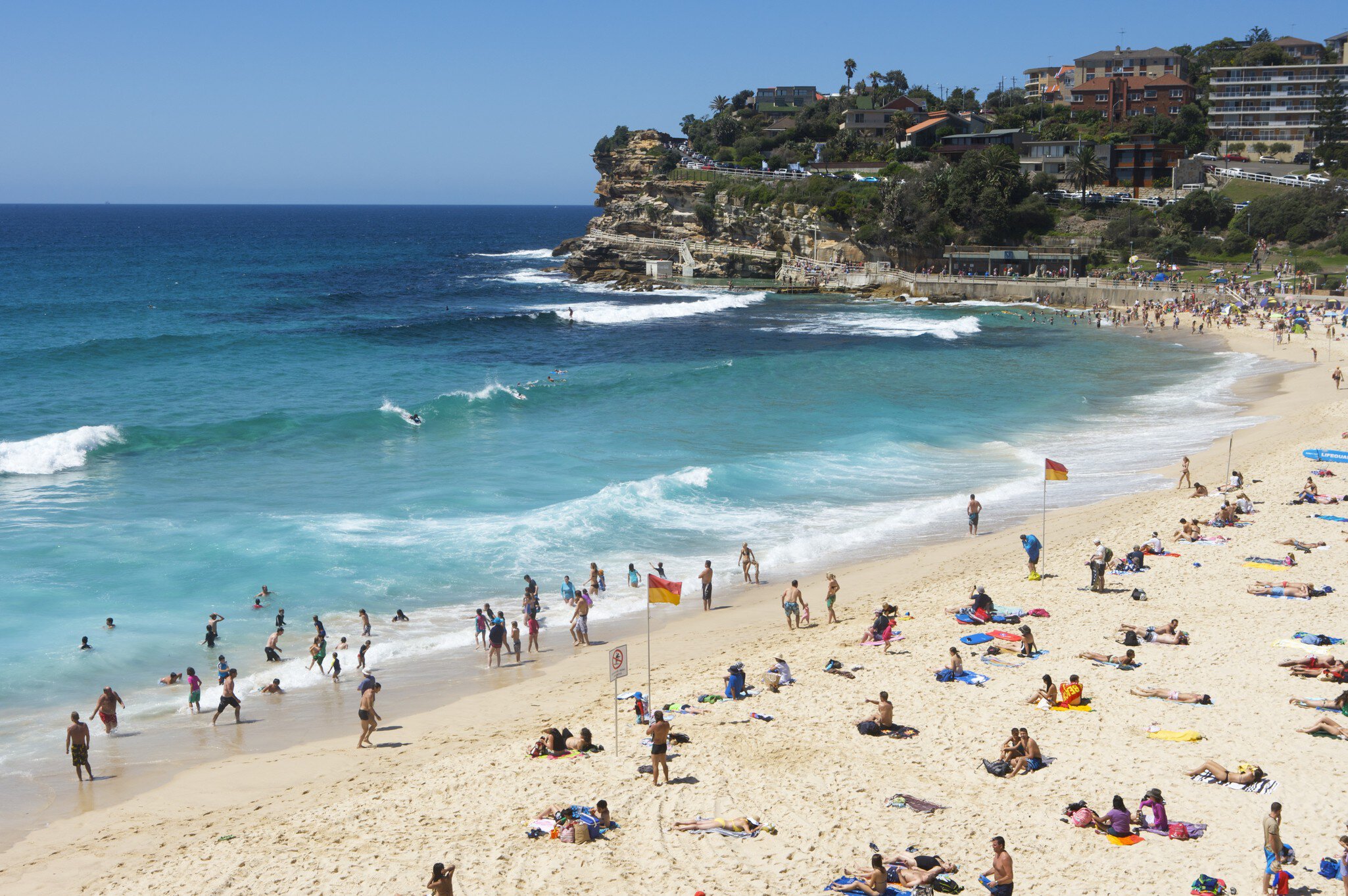 View of swimmers and sunbathers on Bronte Beach in Sydney, Australia.