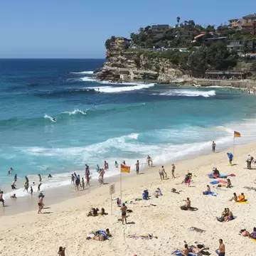 View of swimmers and sunbathers on Bronte Beach in Sydney, Australia.
