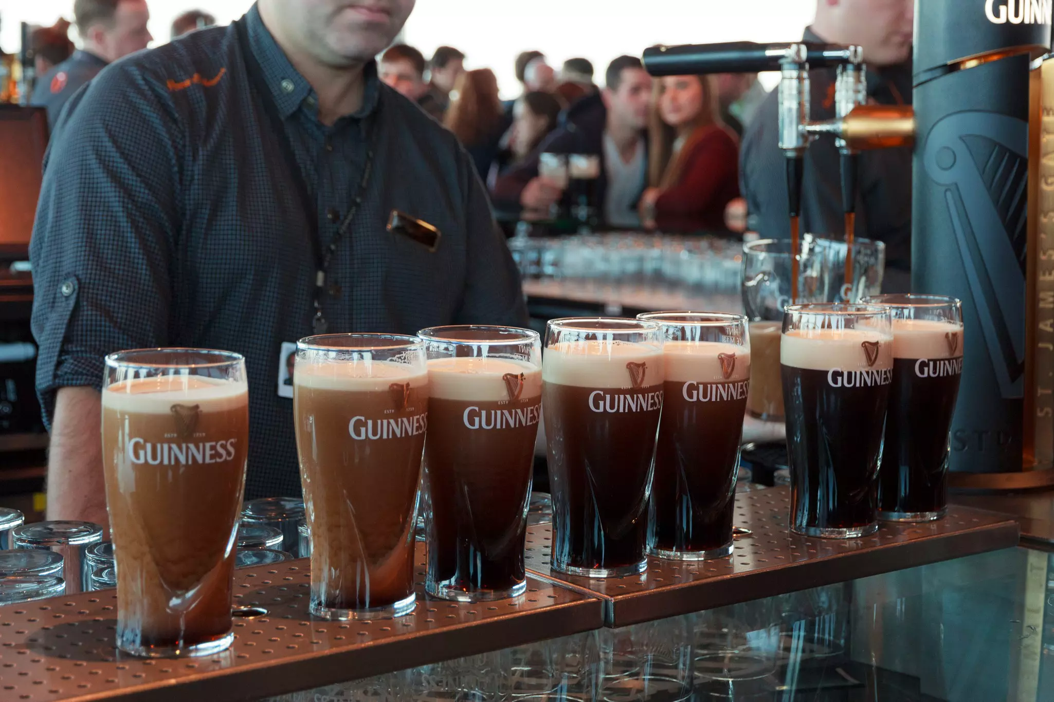 Creamy pints of Guinness “settling” before being topped up and served © VanderWolf Images / Shutterstock