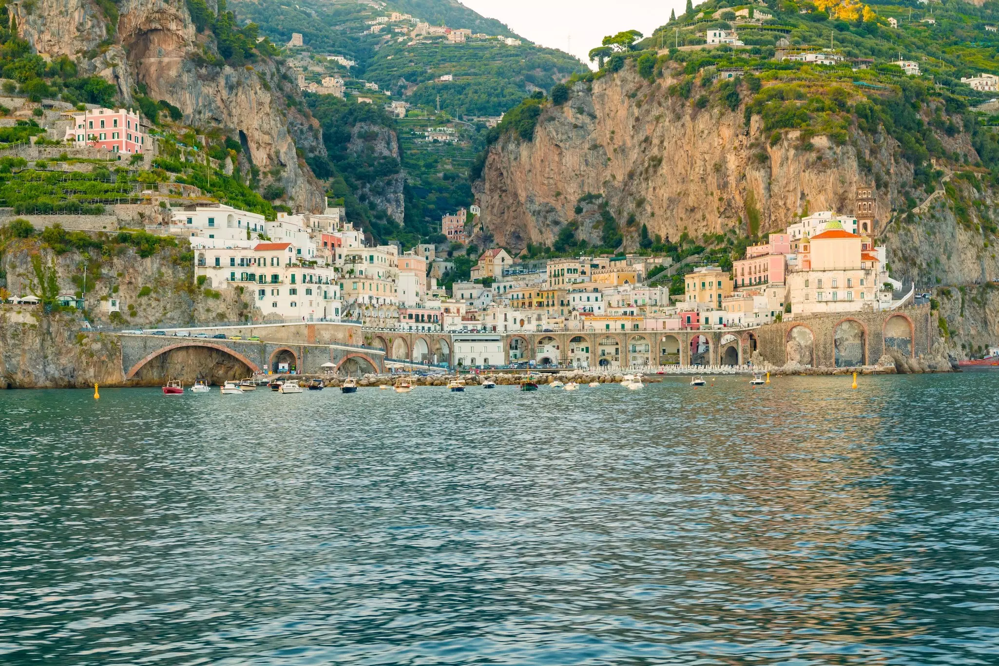 The colorful towns of Atrani and Amalfi nestled between mountains, in Southern Italy