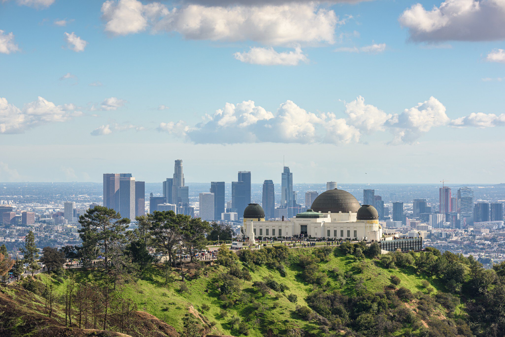 The Griffith Observatory and views of Downtown Los Angeles on a sunny day. 
