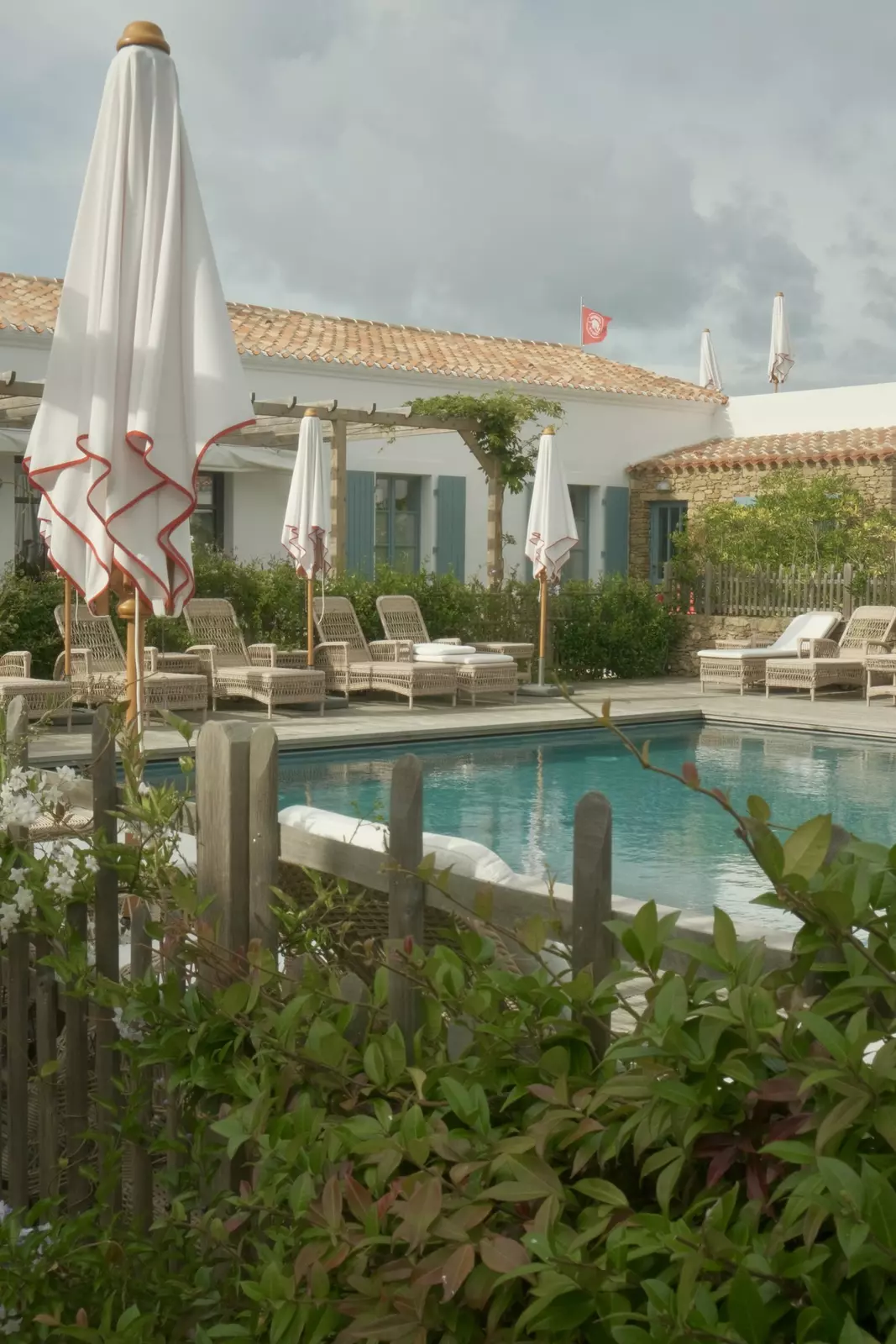 The pool and chairs at Hôtel La Mission. 