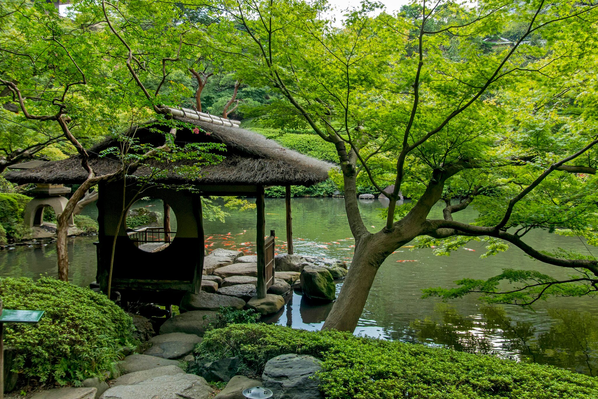 Tokyo, Japan - September 12, 2014: Resting house at the Happo-en Garden in Tokyo. The garden is a beautiful exapmple of Japanese zen-style gardening with restaurant and teahouse facilities.
