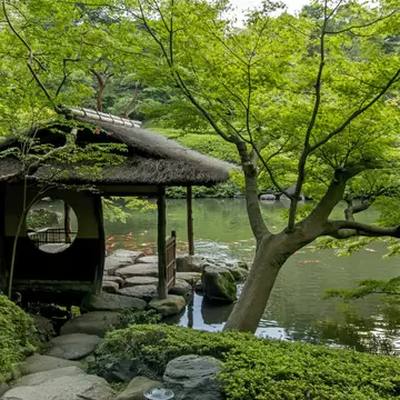 Tokyo, Japan - September 12, 2014: Resting house at the Happo-en Garden in Tokyo. The garden is a beautiful exapmple of Japanese zen-style gardening with restaurant and teahouse facilities.