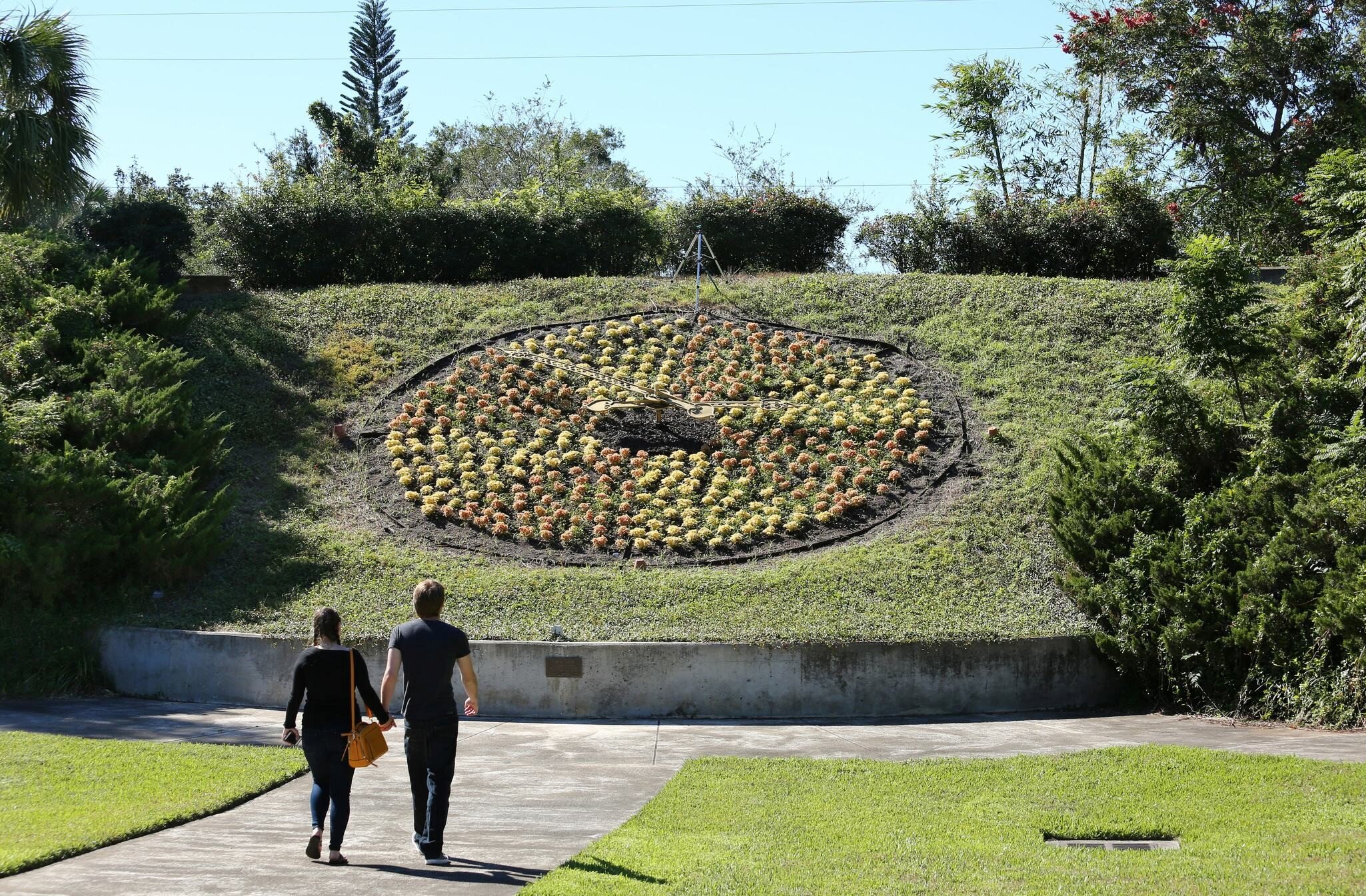 ORLANDO, FL, USA - OCTOBER 29: Visitors admire the larger than life living floral clock at Harry P. Leu Gardens, a destination garden with over 40 diverse plant collections as seen on October 29, 2017