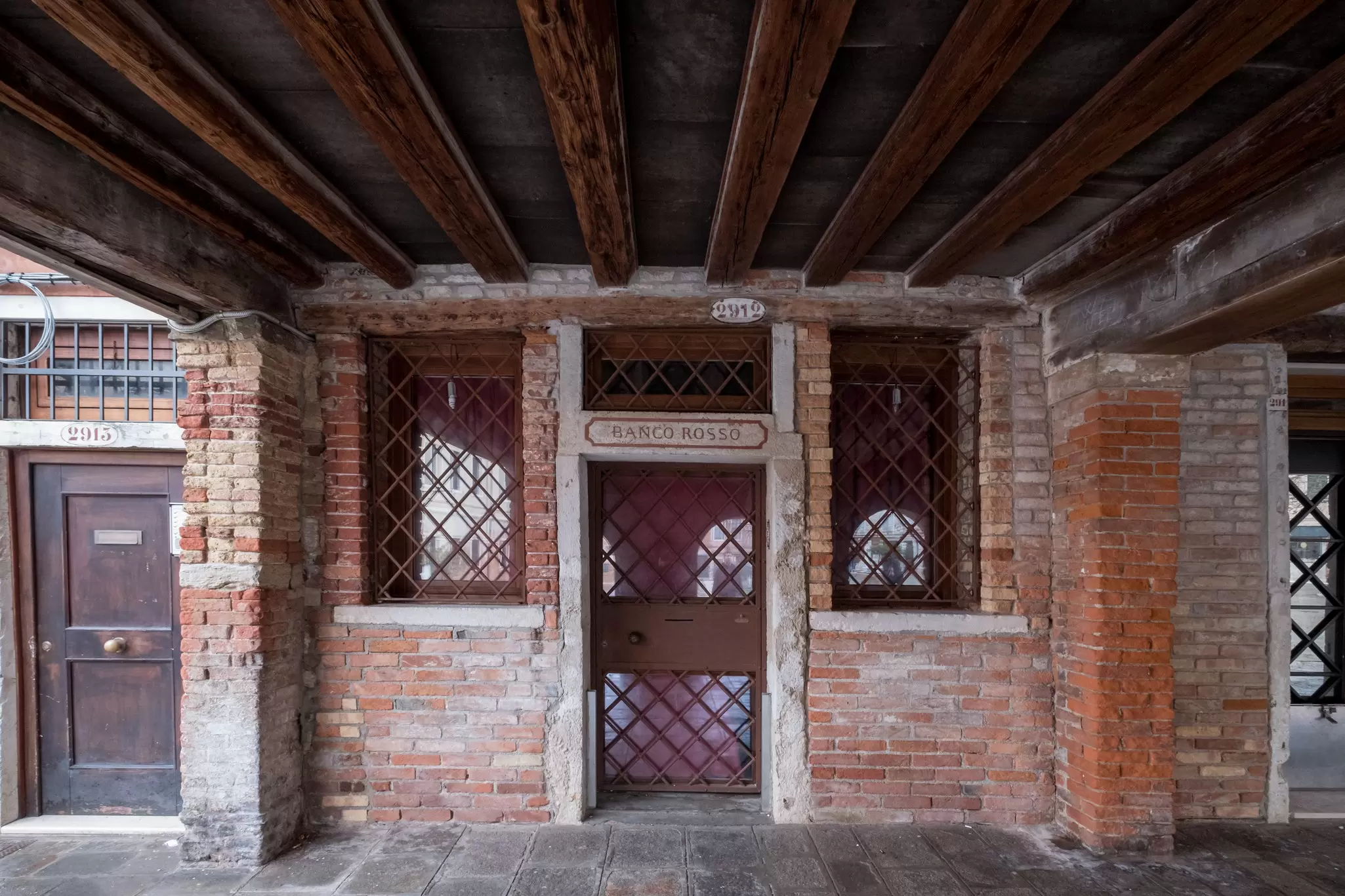 Exterior of the Rosso Banco (The Red Bank) in the Jewish Ghetto in Venice, Italy.