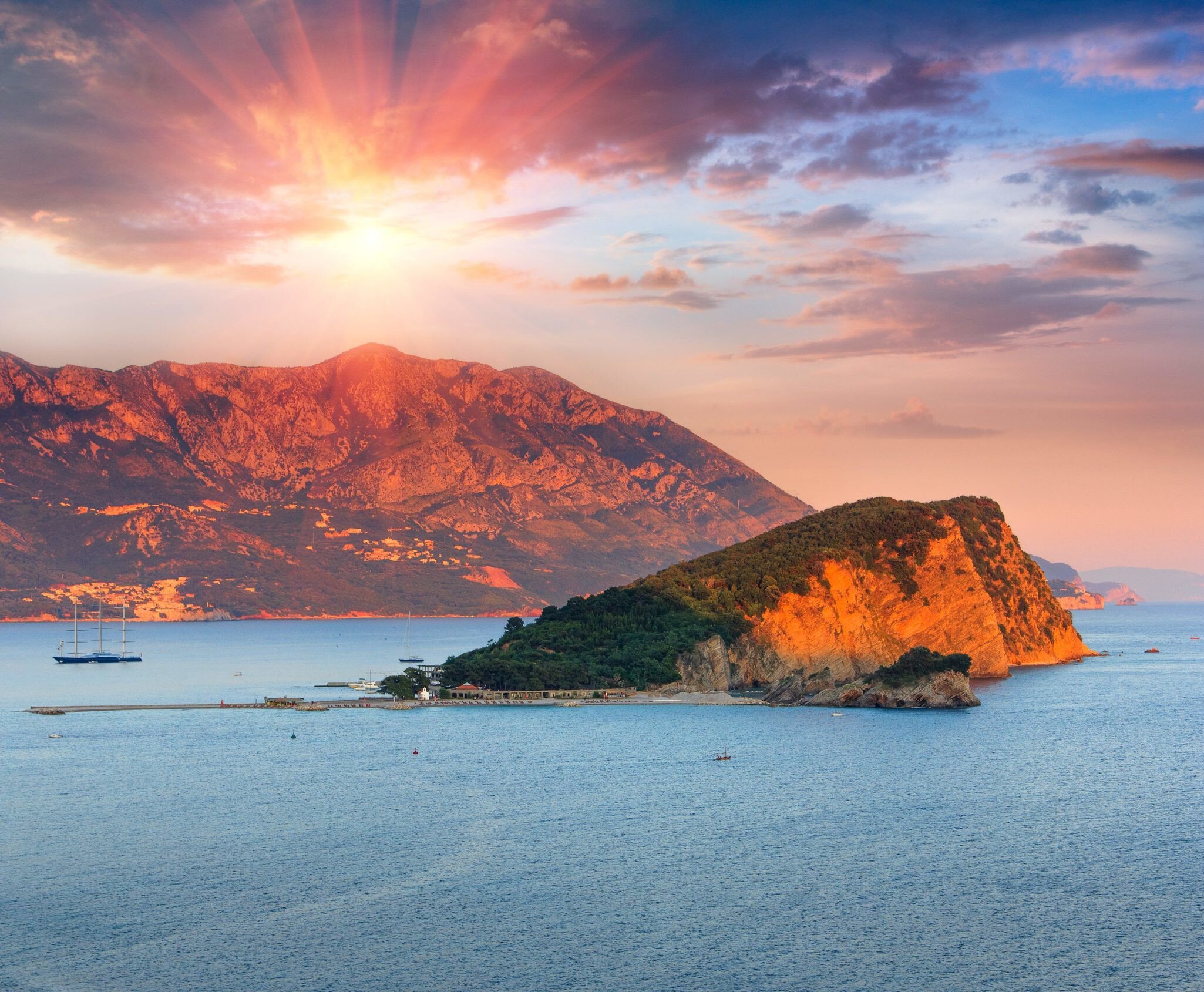 Panoramic landscape of coast Budva riviera:Sveti Nikola island and mountains at sunset. Dramatic evening sky. Balkans, Adriatic sea, Europe.
Landscape of coast Budva riviera:Sveti Nikola island at sunset. - stock photo

