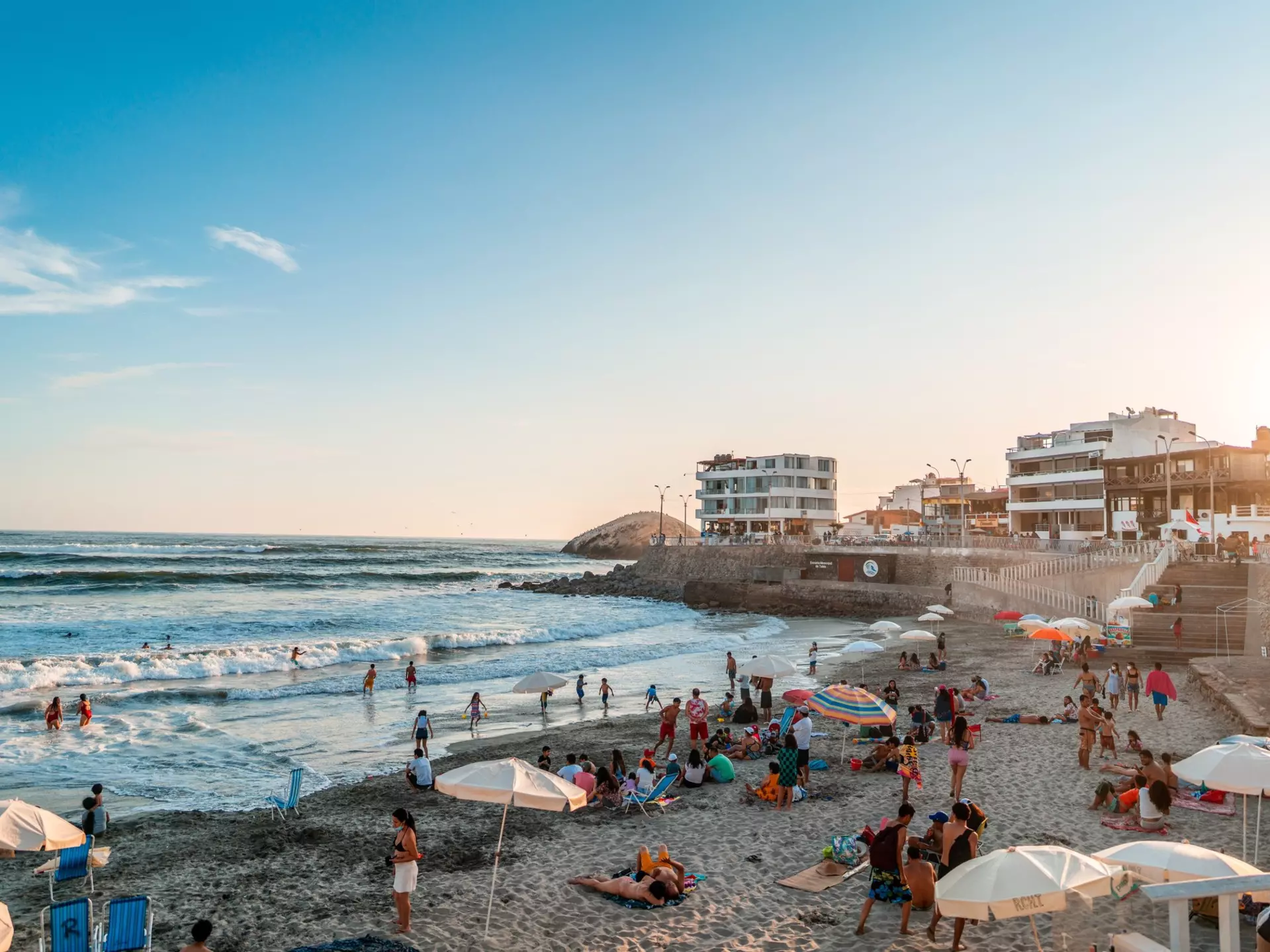 Punta Hermosa beach. Sunny day at the beach. People sunbathing on a beach afternoon. Lima, Peru. 