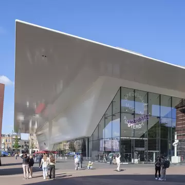 Exterior view of the Stedelijk Museum on a sunny day in Amsterdam.