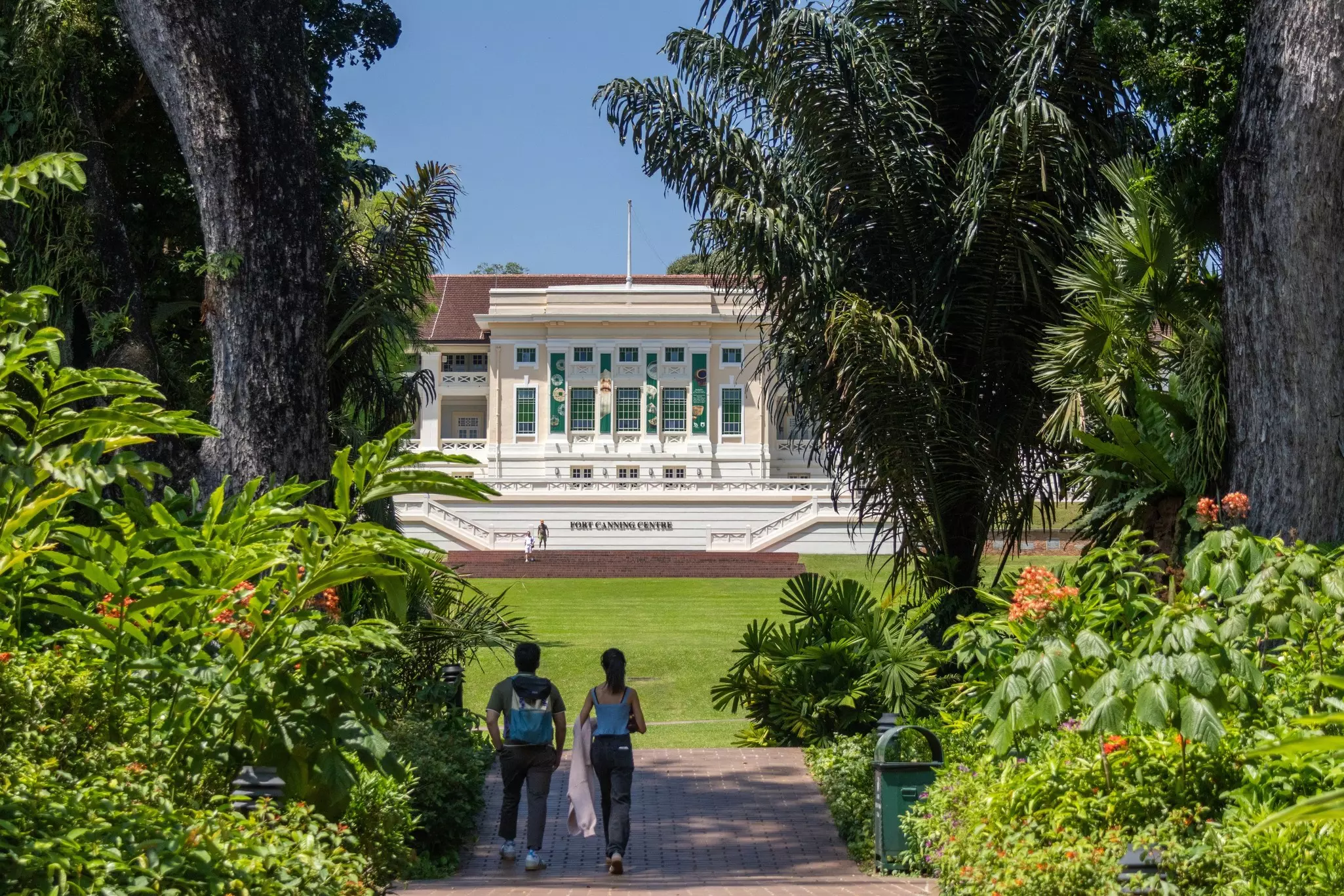 People enjoying the green spaces of Fort Canning Park in Singapore. 