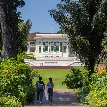 People enjoying the green spaces of Fort Canning Park in Singapore. 