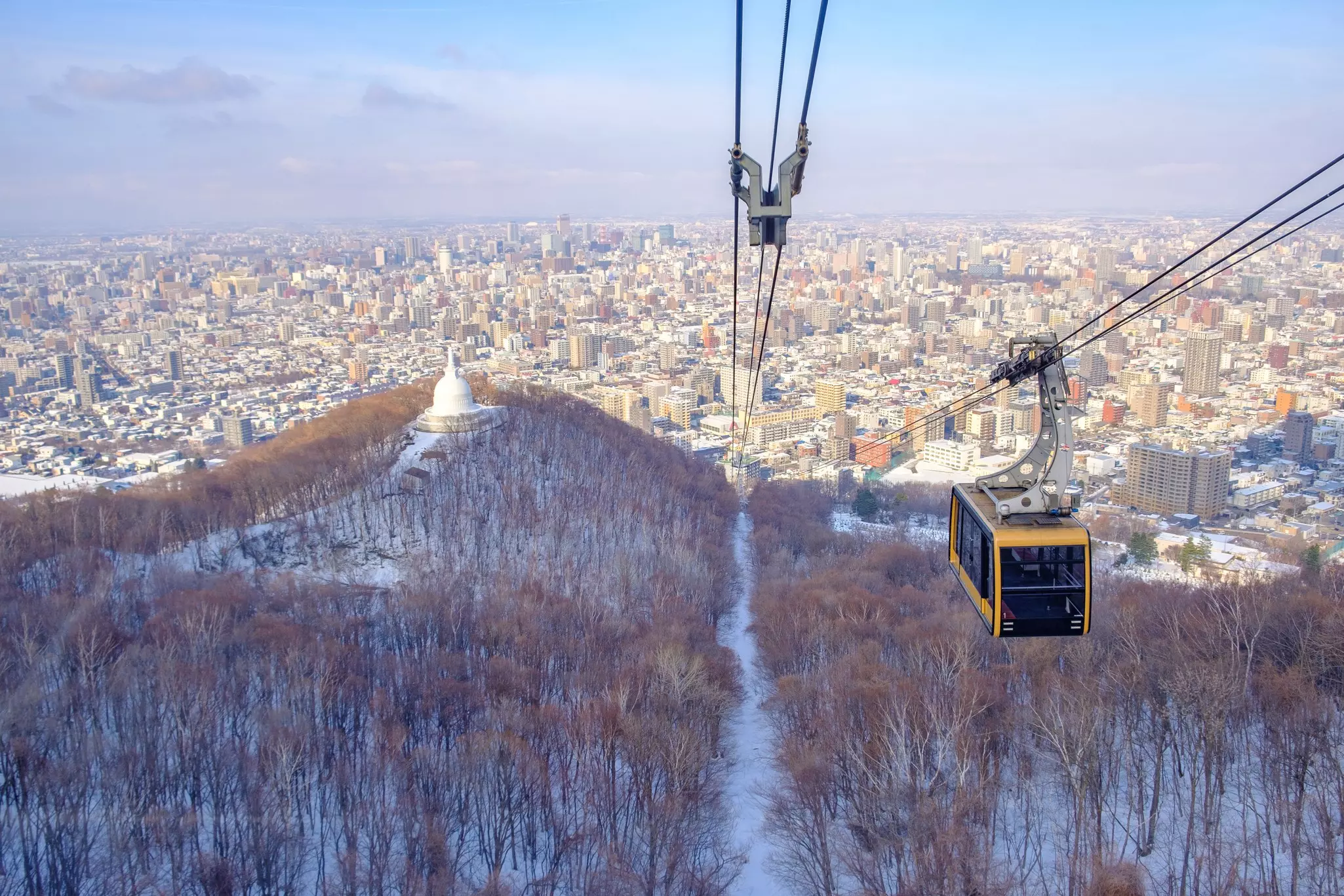 Cable car traveling from the base of Mt Moiwa to the top during the winter season