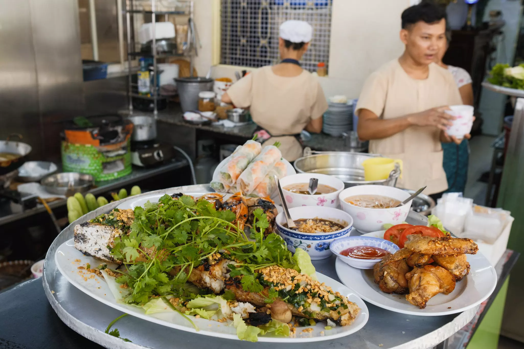 Food on plates at Bánh Xèo 46A restaurant