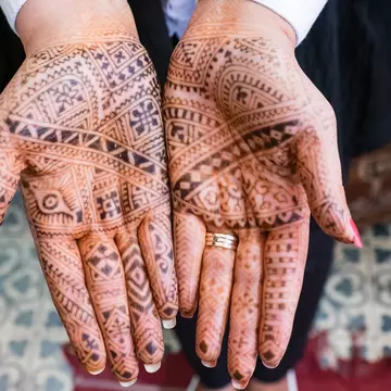 Temporary henna tattos on the hands of a woman in Marakkech.