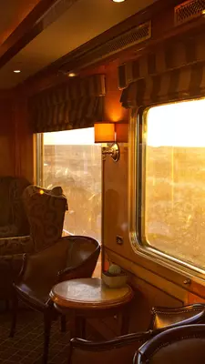 Sunlight streams through the window on a train.