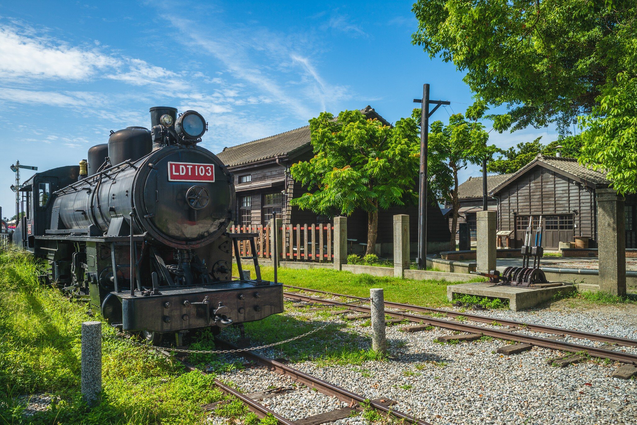Old black train engine parked on tracks at the Hualien Railway Culture Park in Hualien, Taiwan.