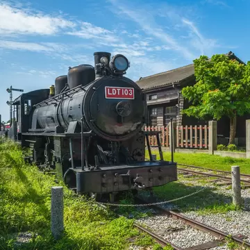 Old black train engine parked on tracks at the Hualien Railway Culture Park in Hualien, Taiwan.