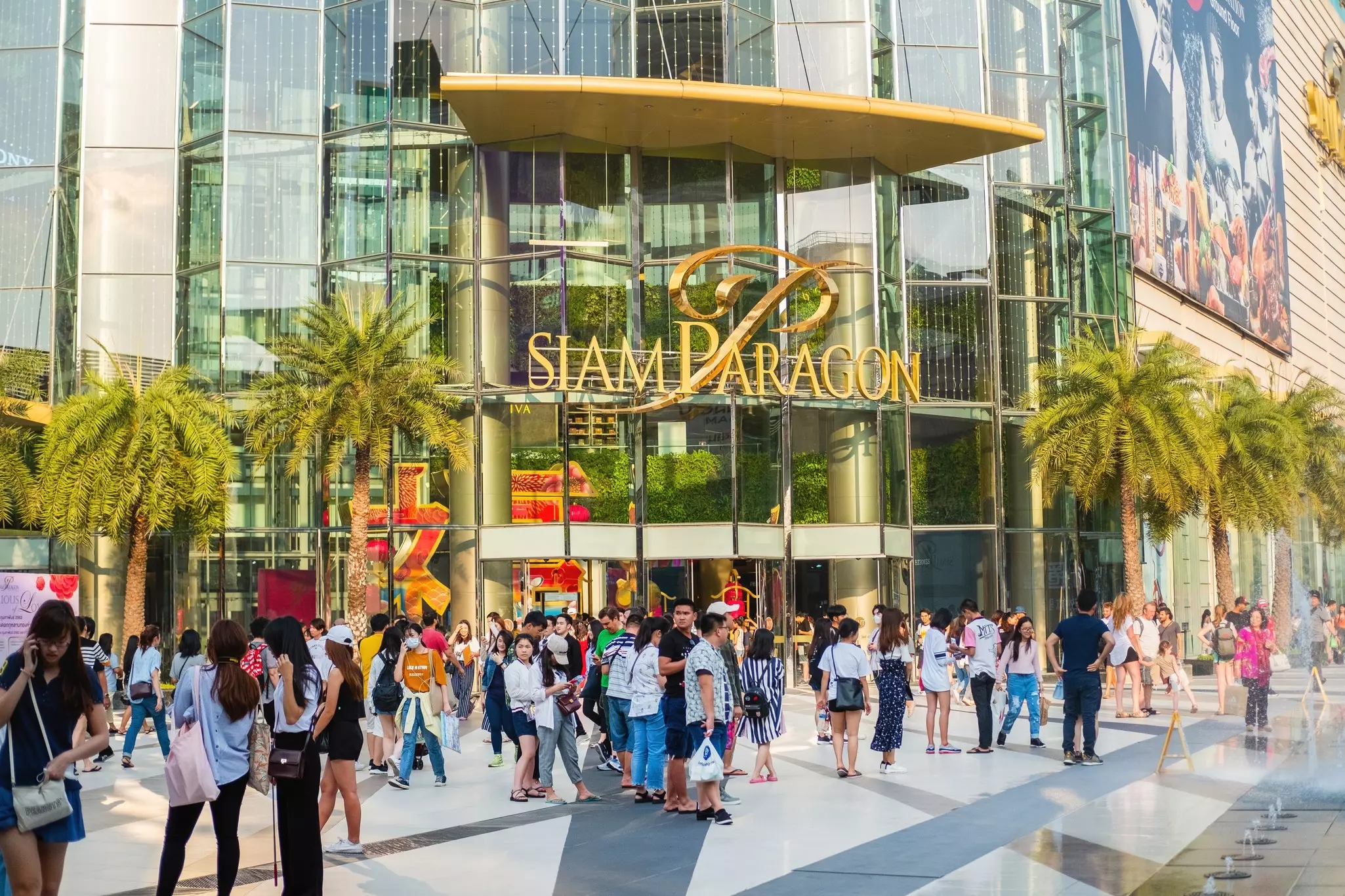The glass exterior of Siam Paragon Shopping Center in Bangkok