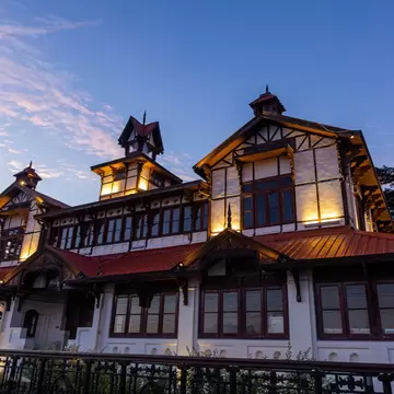 Facade of Bantony Castle lit up at night in Shimla, Himachal Pradesh, India.