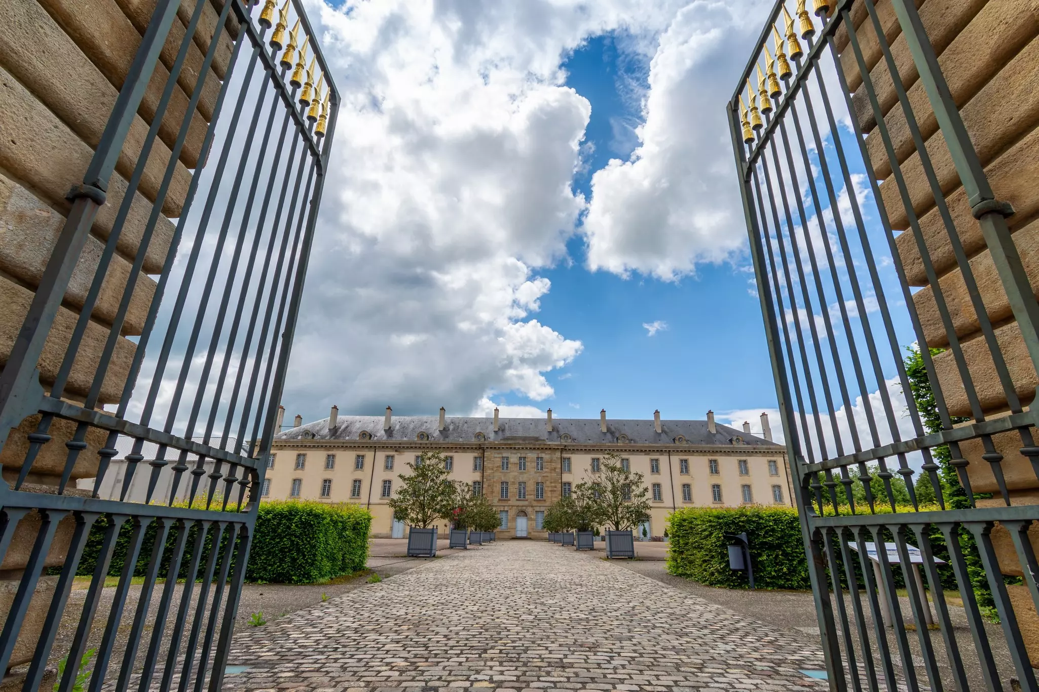 The grand gateway to a vast building that houses the Centre national du costume et de la scène in the French town of Moulins. 