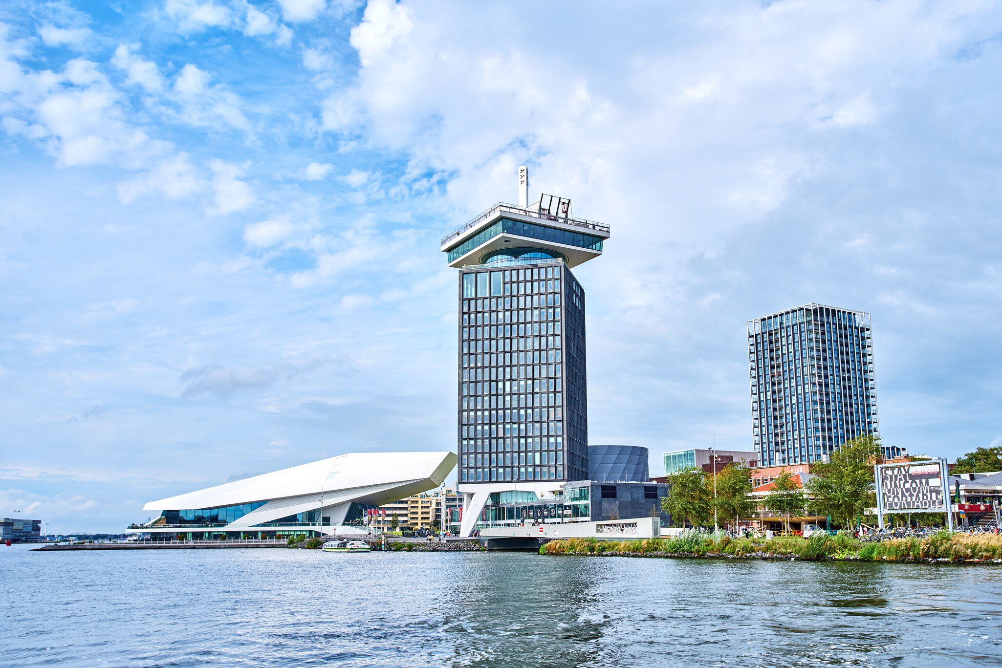 View of the A'DAM Tower from across the water on a sunny day in Amsterdam.  