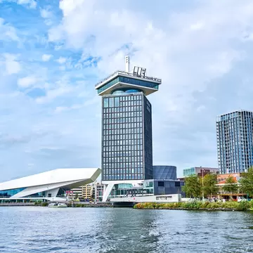 View of the A'DAM Tower from across the water on a sunny day in Amsterdam.  