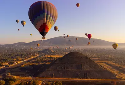 Sunrise on hot air balloon over the Teotihuacan pyramid