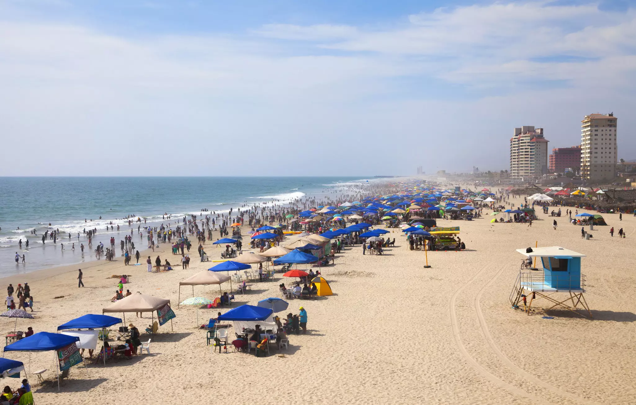 Rosarito, Baja California, Mexico - July 27, 2014: A Locals and tourists enjoying a sunny afternoon at   Rosarito beach, a coastal resort city in Baja California, Mexico.