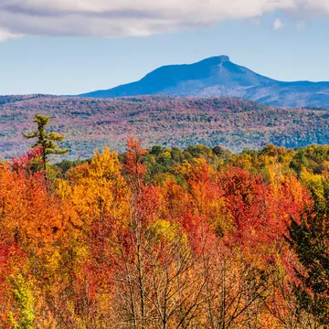 Brilliant fall foliage covers the valleys below Camel's Hump Mountain (4083 feet).