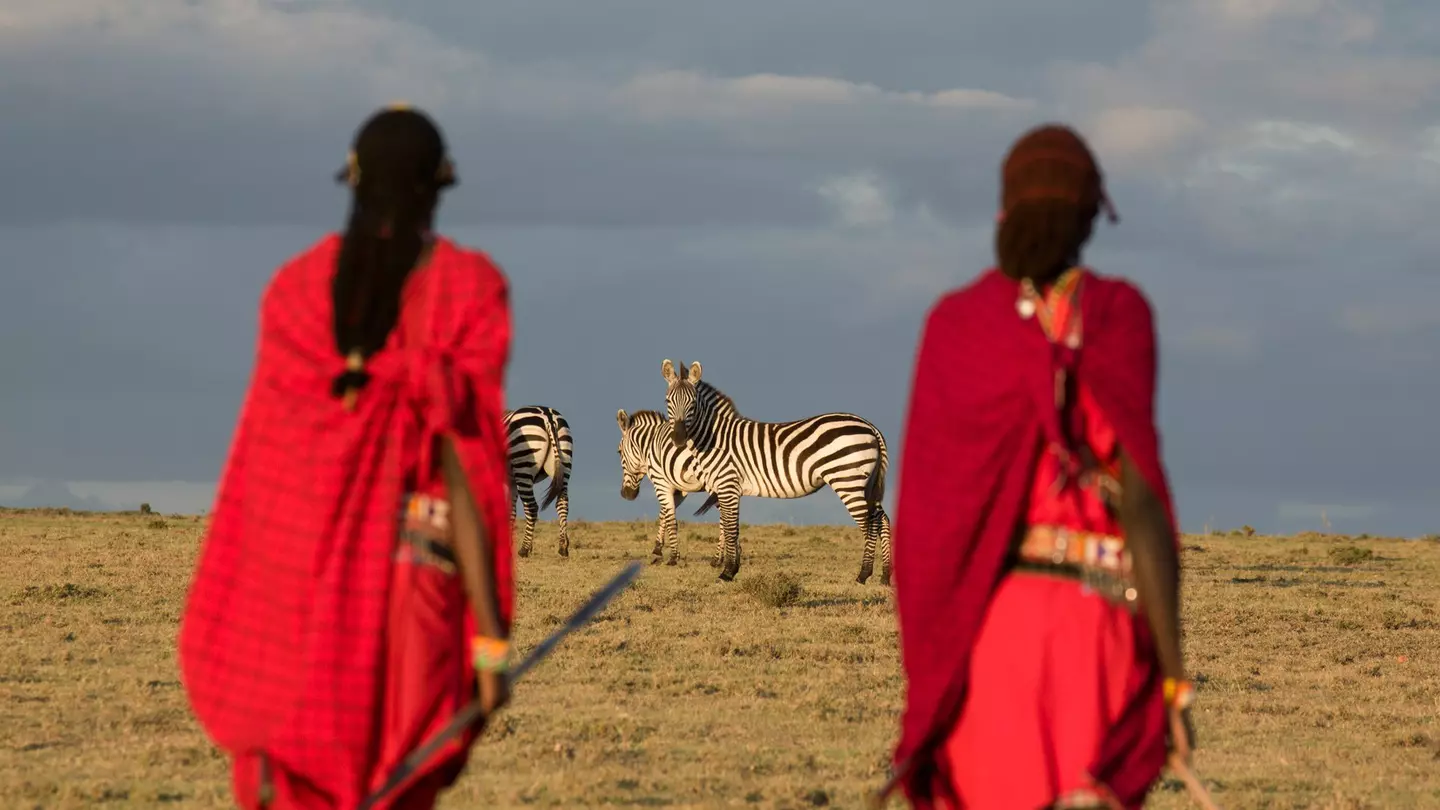 Maasai tribesmen in the Maasai Mara National Park. Kenya. Africa.