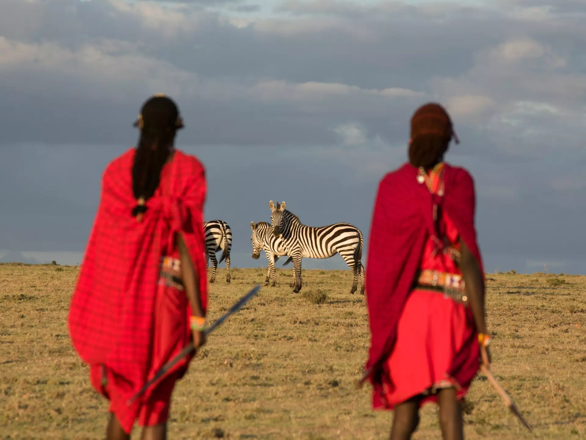 Maasai tribesmen in the Maasai Mara National Park. Kenya. Africa.