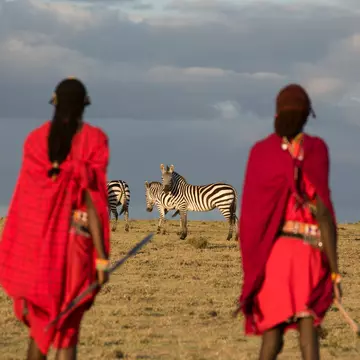 Maasai tribesmen in the Maasai Mara National Park. Kenya. Africa.