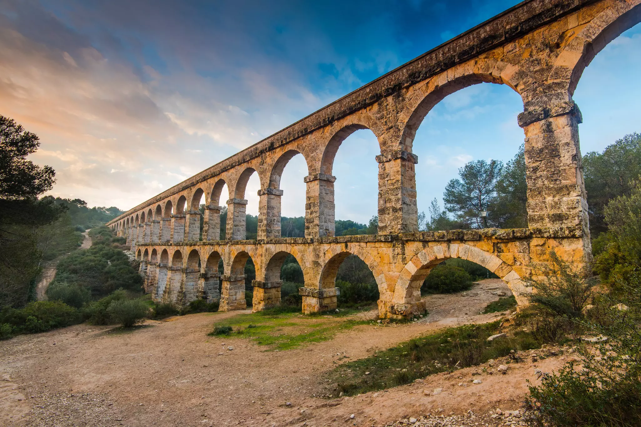Roman Devil’s aqueduct in Tarragona, Spain at sunset